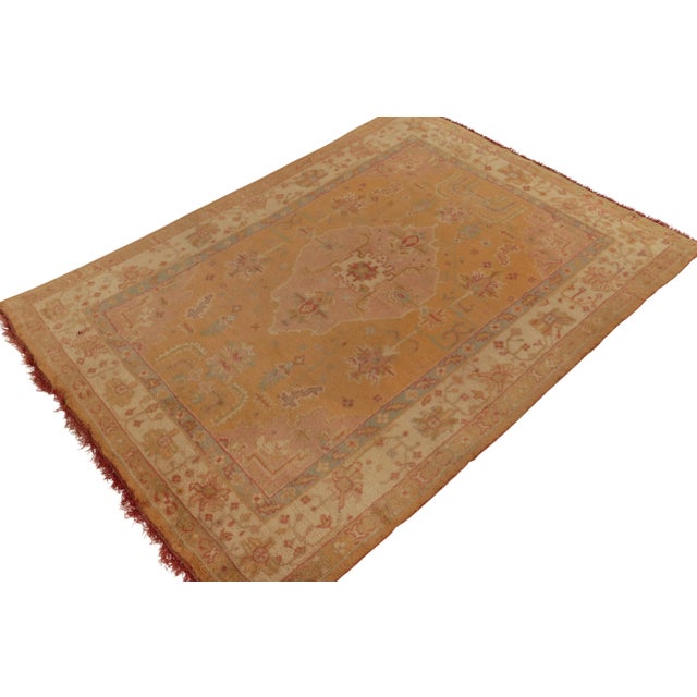 Hand-knotted in wool circa 1920-1930, an 8x11 antique Oushak rug among the personal favorite classic curations of Josh...