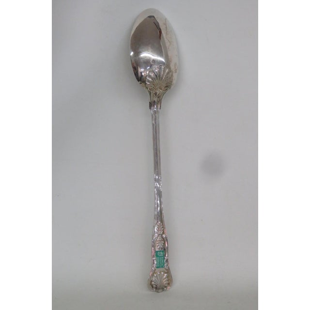 This lovely Large Serving Spoon is metal and silverplated. The back of the handle is labeled "TOWLE Silversmiths |...