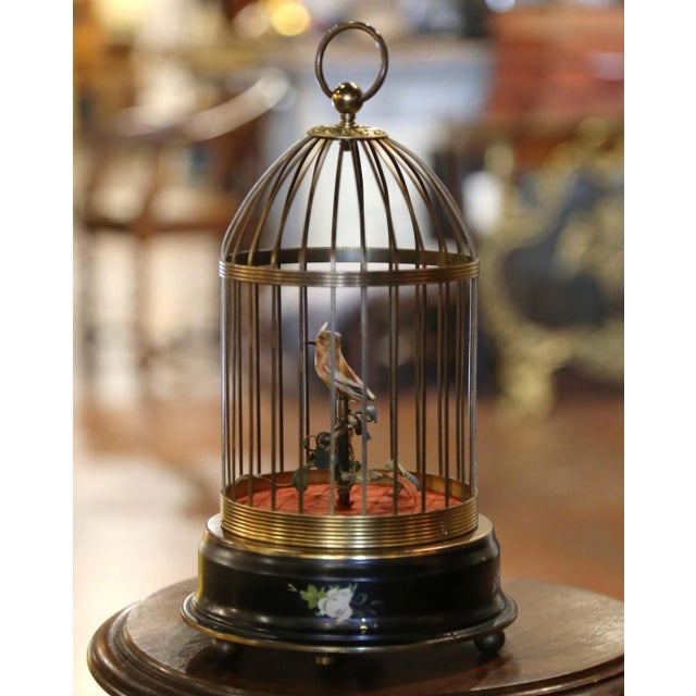 This charming vintage Swiss singing bird automaton combines intricate mechanical craftsmanship with delightful decorative...