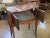 This 19th-century French chevet table is a charming example of the period's fine craftsmanship and elegant design. Crafted...
