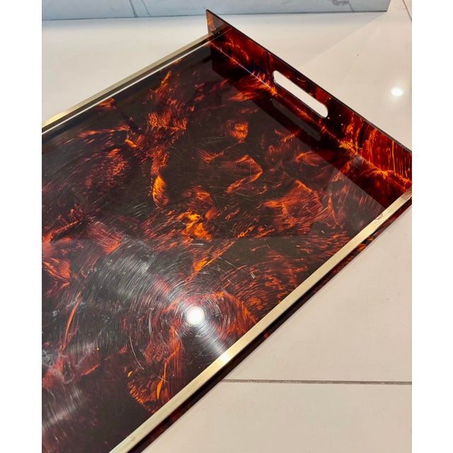 Large twin handled vintage faux tortoiseshell lucite drinks serving tray with brass baton sides in a design by Willy Rizzo...
