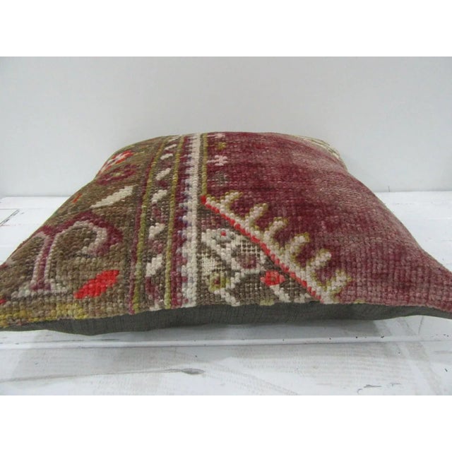 This is a pillow cover made from a vintage kilim rug. The piece was properly washed and ready to use. Pillow inserts not...