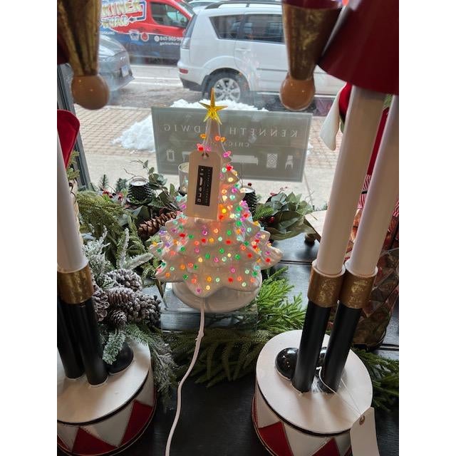 Elevate your holiday décor with the 16.5" Lighted Vintage White Tree. This charming tree features a classic vintage white...