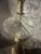 Beautiful antique clear blown glass oil lamp converted to electricity. The glass lamp is in a swirl design, & sits on a...