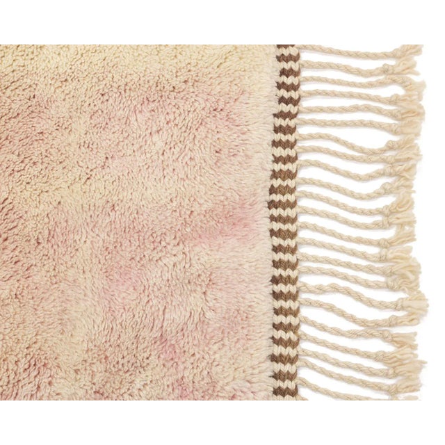 Luxurious hand-knotted wool rug with abstract Midnight black, Military Olive, Peach Nougat, and Barely Pink blocks on an...