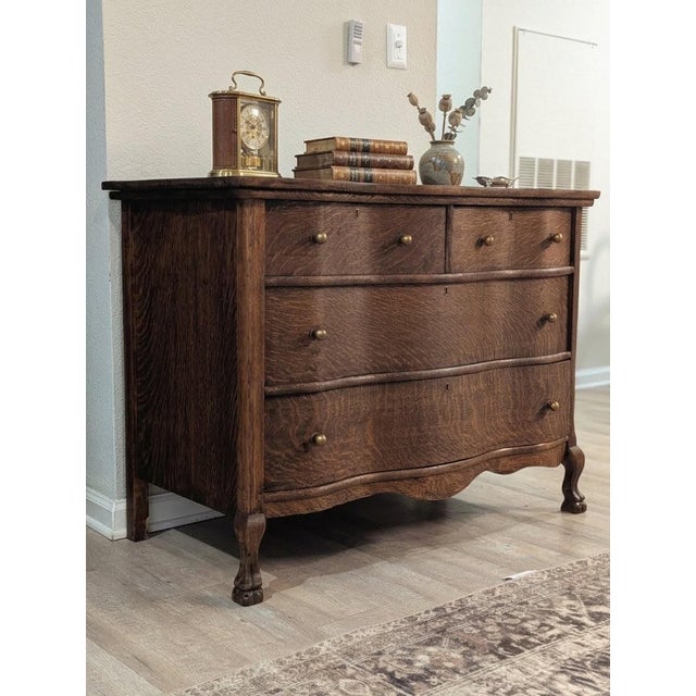 Solid wood, dovetail dresser! This piece features beautiful tiger oak grain, a gently curved front, and warm wood tones...