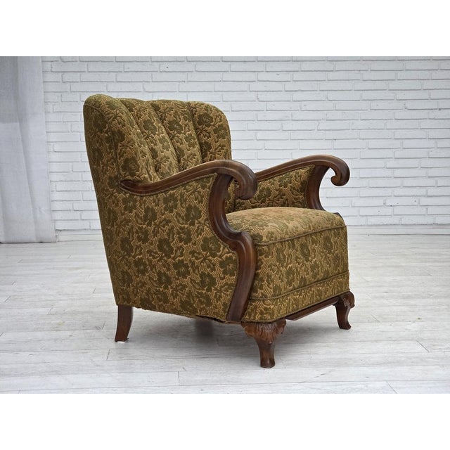 1950s, Danish armchair. Green furniture wool, hand carved oak wood, brass springs in the seat. Original good condition: no...