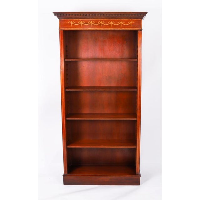This is a beautiful Vintage open bookcase in the Sheraton style, dating from the late 20th Century. The bookcase has five...