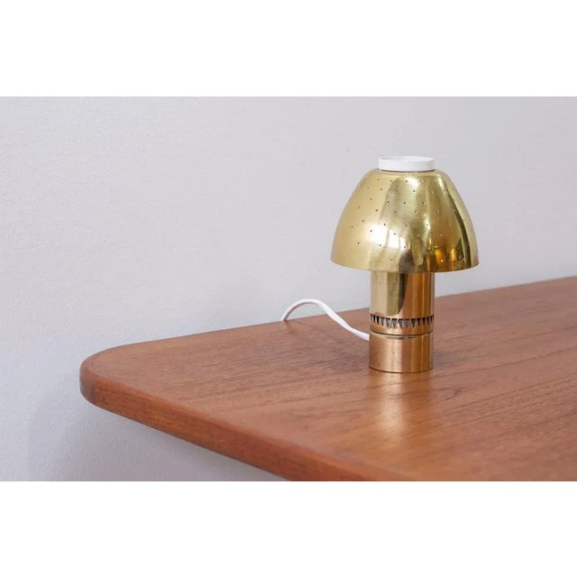 Brass table lamp model Flora designed by Hans-Agne Jakobsson. Produced by his own company in Markaryd, Sweden during the...