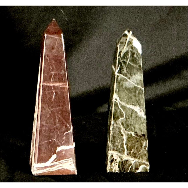 Eclectic and visually striking collection of ten decorative obelisks, each crafted from a variety of fine materials...