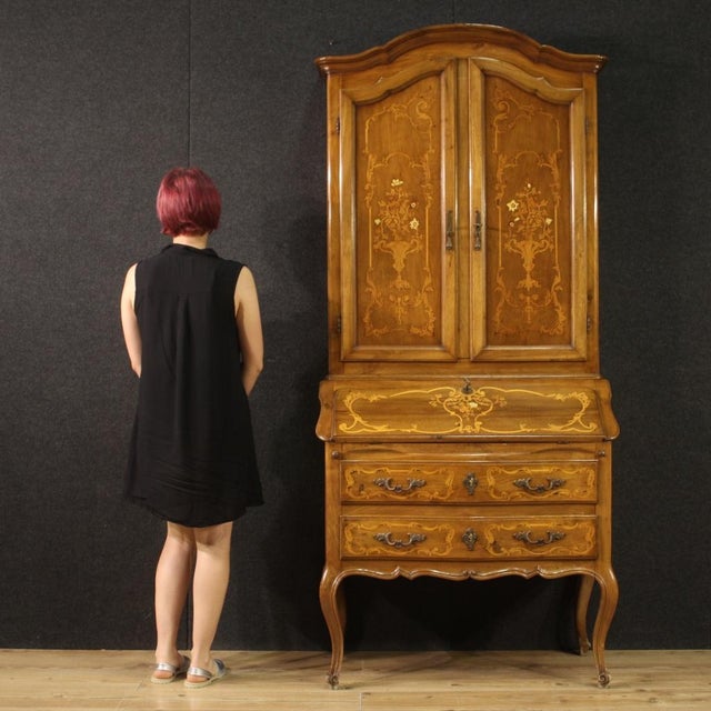 Italian trumeau from 20th century. Louis XV style furniture nicely inlaid in walnut, maple and fruitwood. Double body...