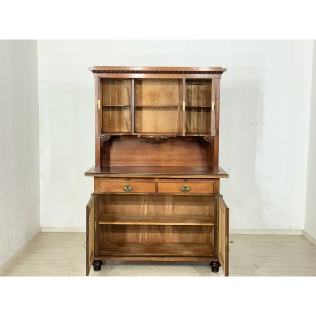 Beautiful, well-preserved sideboard made of high-quality solid wood, distinguished by its artistic carvings and charming...