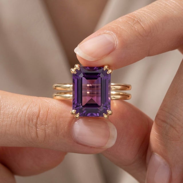 This exquisite ring features a striking Amethyst gemstone, prized for its rich, royal purple hues and captivating depth....