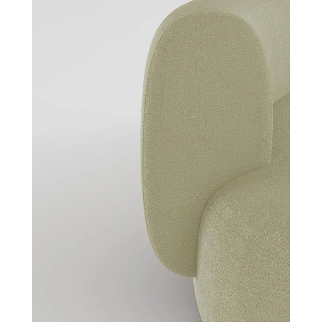 Hug sofa is defined by clean, simple lines and a distinctive armrest detail. The armrest, half overlapping the seat...