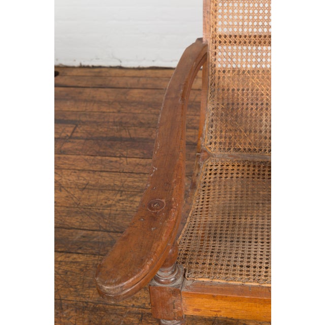Dutch Colonial Indonesian Cane and Wood Plantation Chair with Extending Arms For Sale - Image 12 of 12