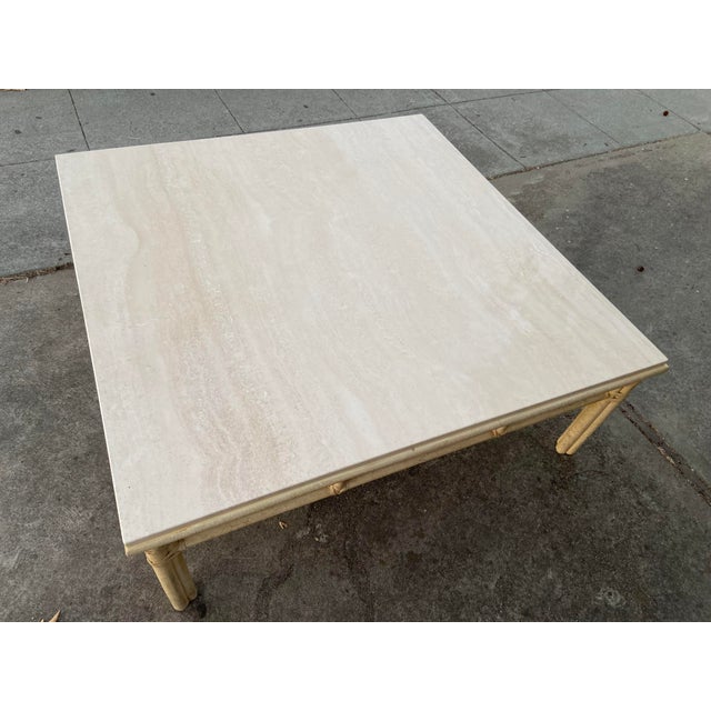 The McGuire Furniture Vintage Mid Century Bamboo Limestone Coffee Cocktail Table is a beautifully crafted antique piece...