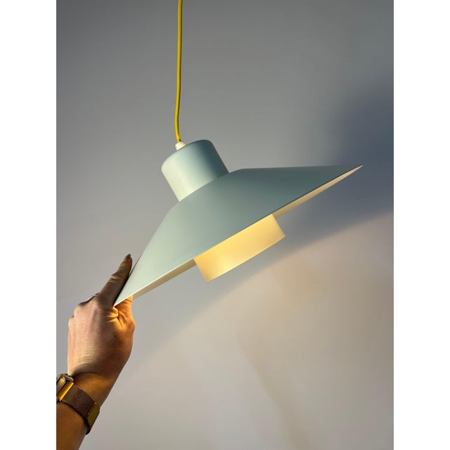 This white slatted lamp from Lyskær Belysning is a wonderful example of the geometric rigor and minimalist spirit of...