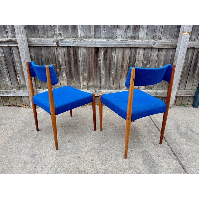 Rare 1960's teak side chairs by Dutch maker Groot Landeweer of Eibergen, The Netherlands. Solid teak frames with blue...