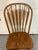A striking set of four vintage arrow-style back Windsor dining chairs crafted from sturdy, solid oak. This beautifully...