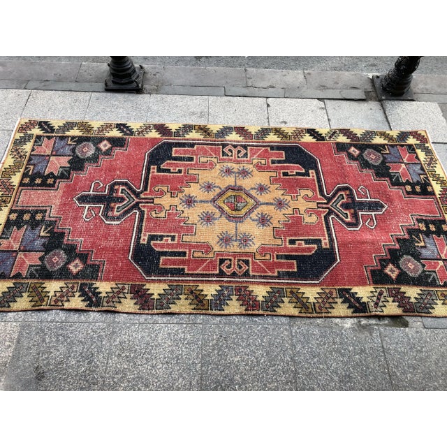 This is a vintage Turkish Oushak rug from the 1960s. The piece was hand-knotted.