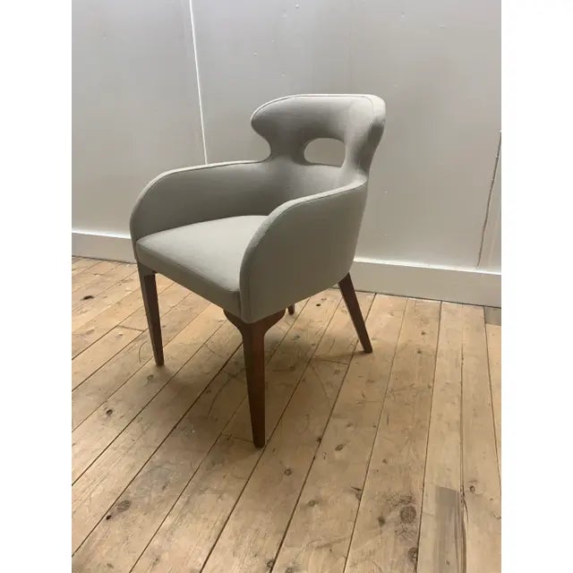 The Comfy chair Attributed to Brueton is genuinely comfortable; a stylized chair that offers form fitting contours and...