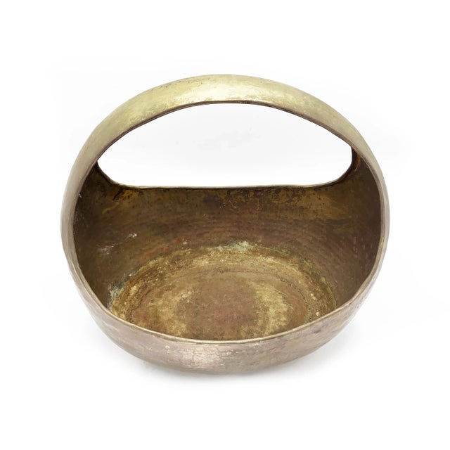 Vintage solid brass basket, hand crafted and hammered in Iran. The art form of hammering has been common in Iran since...