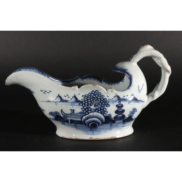 English Delftware Blue and White Chinoiserie Sauce Boat, London English, London, Circa 1750–1760 This English delftware...