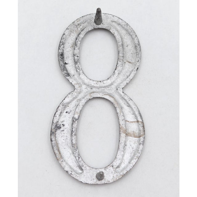 Vintage brushed aluminum numeral 8 outdoor house or building marker with two prongs on the back. Good condition with...