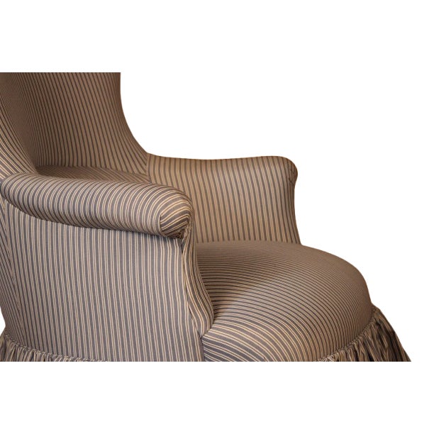 Newly reupholstered in Wellfleet Ticking Stripe in Pacific by Schumacher. With gathered skirt. In excellent antique...