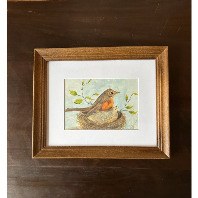 A robin and baby in a nest. Watercolor and Colored Pencil. Ready to hang.