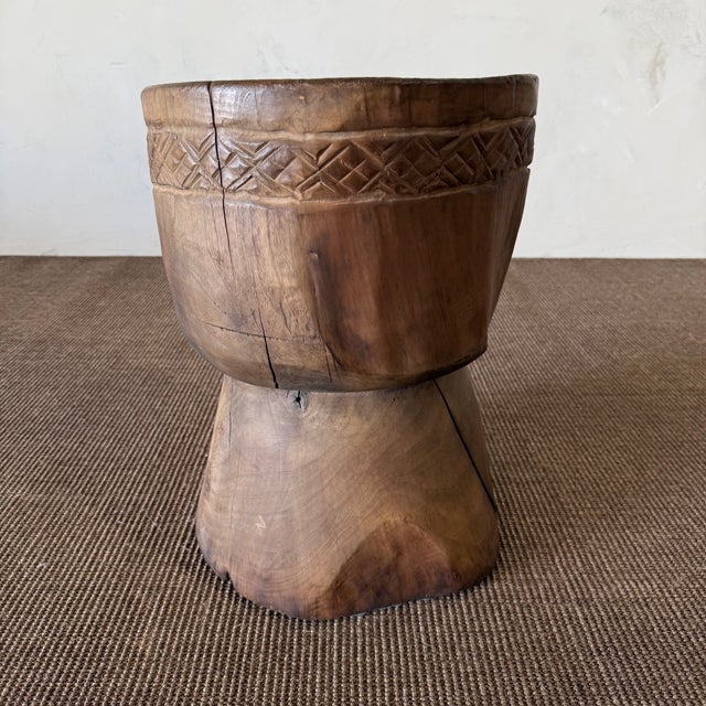 Size: 13"D x 17.5"H Wood Species: Walnut Finish: Natural Crafted from solid walnut wood with a natural finish, this...