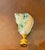 Serpentine blue polished mother of pearl turbo sea shells on a brass base as lamp finial.