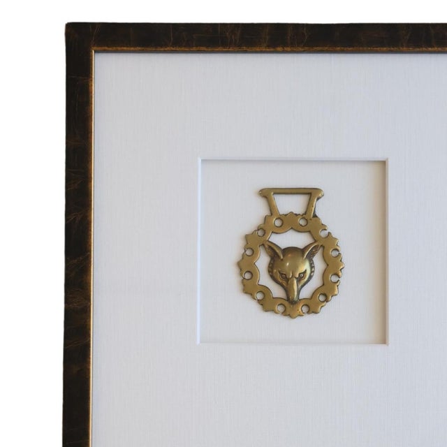 This striking antique horse bridle medallion, crafted in 19th century France, features a bold and captivating wolf design,...