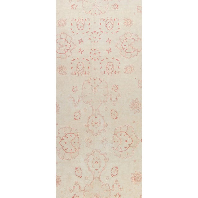 A hand knotted wool Agra design rug circa 1960. Elevate your floor with this beautiful rug! Colors: ivory/beige/taupe