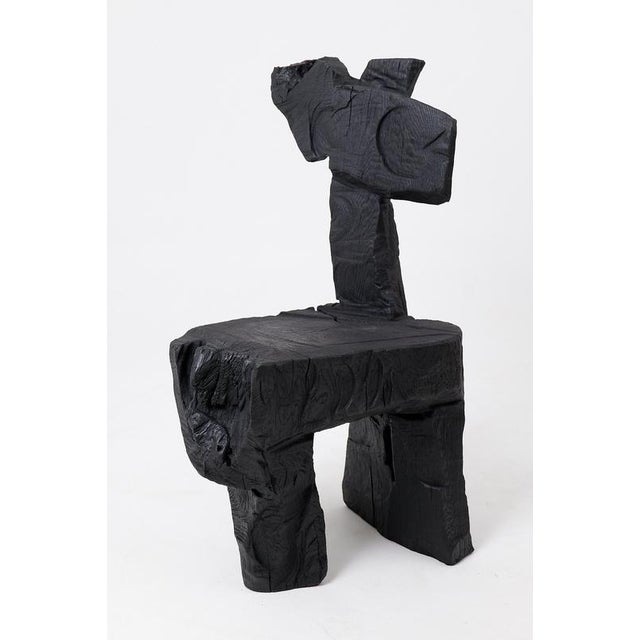 This chair is a one of a kind functional sculpture, hand carved from solid hardwood. It is defined by its highly abstract...