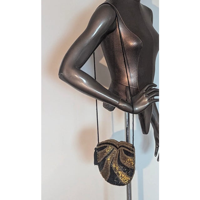 The eighties version of the flapper era purse. The colors of the beads are shimmery and vibrant like the design.