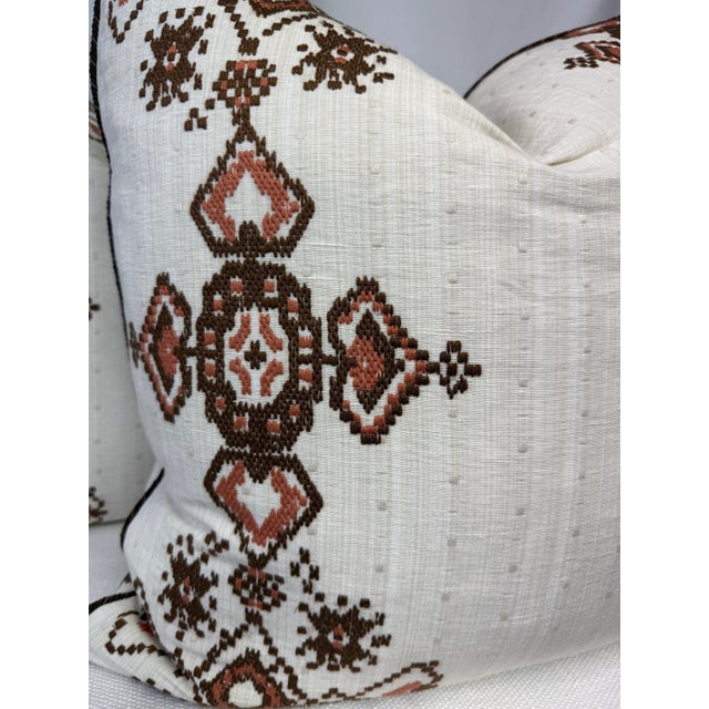 Custom pair of 22" pillows covered in Schumacher "Nadira Embroidery" in cocoa and welted in Samuel & Sons "Annecy Cord...