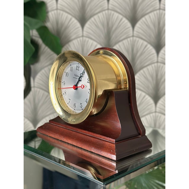 5.5" Brass Chelsea Shipstrike Quartz Mantel/Desk Clock & Traditional Wooden Base Dimensions: 7 1/4" TALL 9 1/2" WIDE 4"...