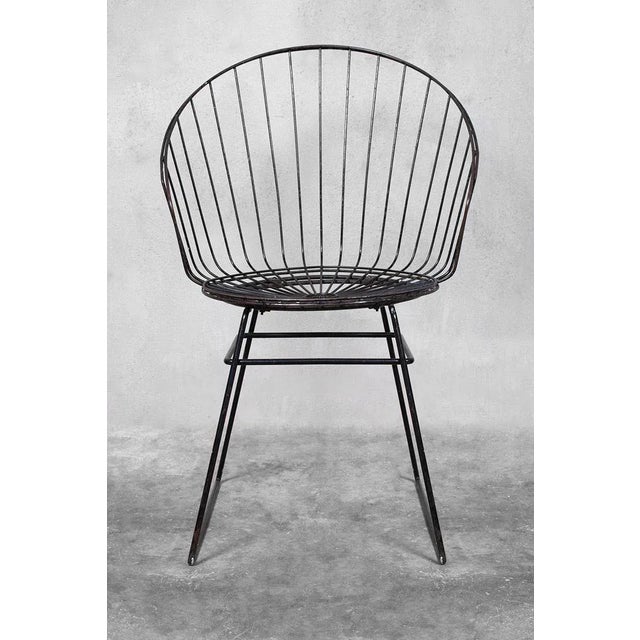 - Wire chair with black metal - Designed by Cees Braakman - Produced by Pastoe in the 1950s This piece is attributed to...