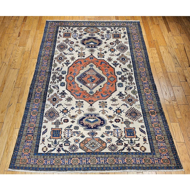 "A striking vintage Persian Ardabil rug from the mid-20th century, this room-size carpet showcases the iconic “signature...