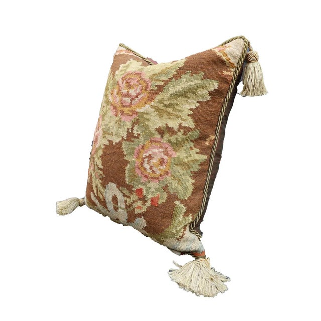 This bessarabian hand woven pillow is 100% wool and it's floral pattern, gold braided trim and tassel corners would bring...