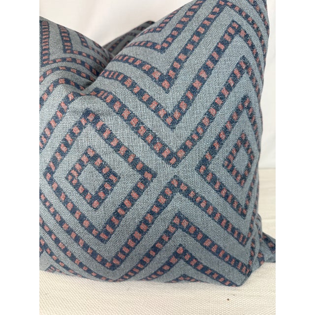 Custom pair of 22" pillows covered in Peter Dunham "Mansa" in blue/red indoor/outdoor fabric. These pillows have tapered...