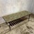 A distinctive mid-century modern coffee table featuring a colourful mosaic-effect Formica top, slender black metal frame...