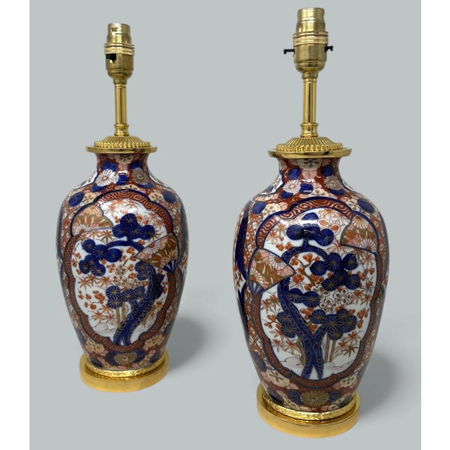 Stunning Pair Traditional Japanese Imari Bulbous Form Porcelain Vases of medium to large proportions, now converted to a...