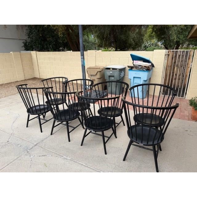 Eight solid handmade Hardwood high-backed black Dining Chairs by Paola Navone, made in the late 20th century America, with...