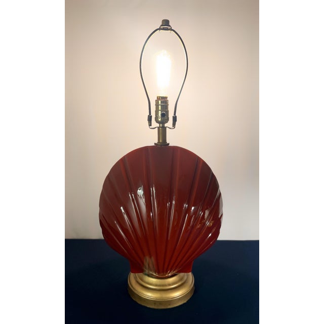 This striking piece is a masterclass in Postmodern geometry, featuring a bold, oversized scallop shell silhouette that...