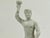 A souvenir from the 1936 Olympic Games. Statue is made out of fine white bisque, the base bears the Olympic Rings, is...