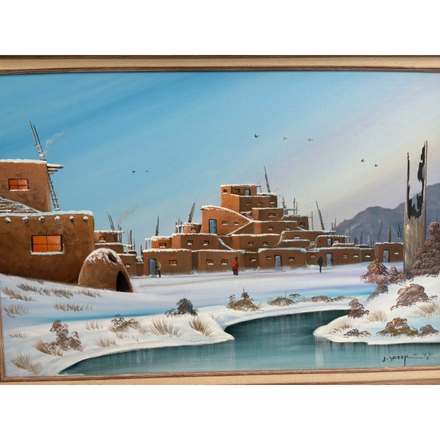 Beautiful original oil painting by Navajo artist Johnny Yazzie, dated 1987. The artwork depicts a serene winter landscape...
