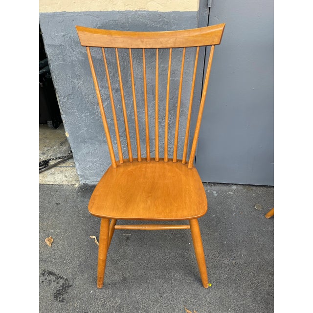Mid century dining chairs by Ethan Allen. They are maple spindle back country style, in good condition. There are 4 chairs...