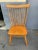 Mid century dining chairs by Ethan Allen. They are maple spindle back country style, in good condition. There are 4 chairs...